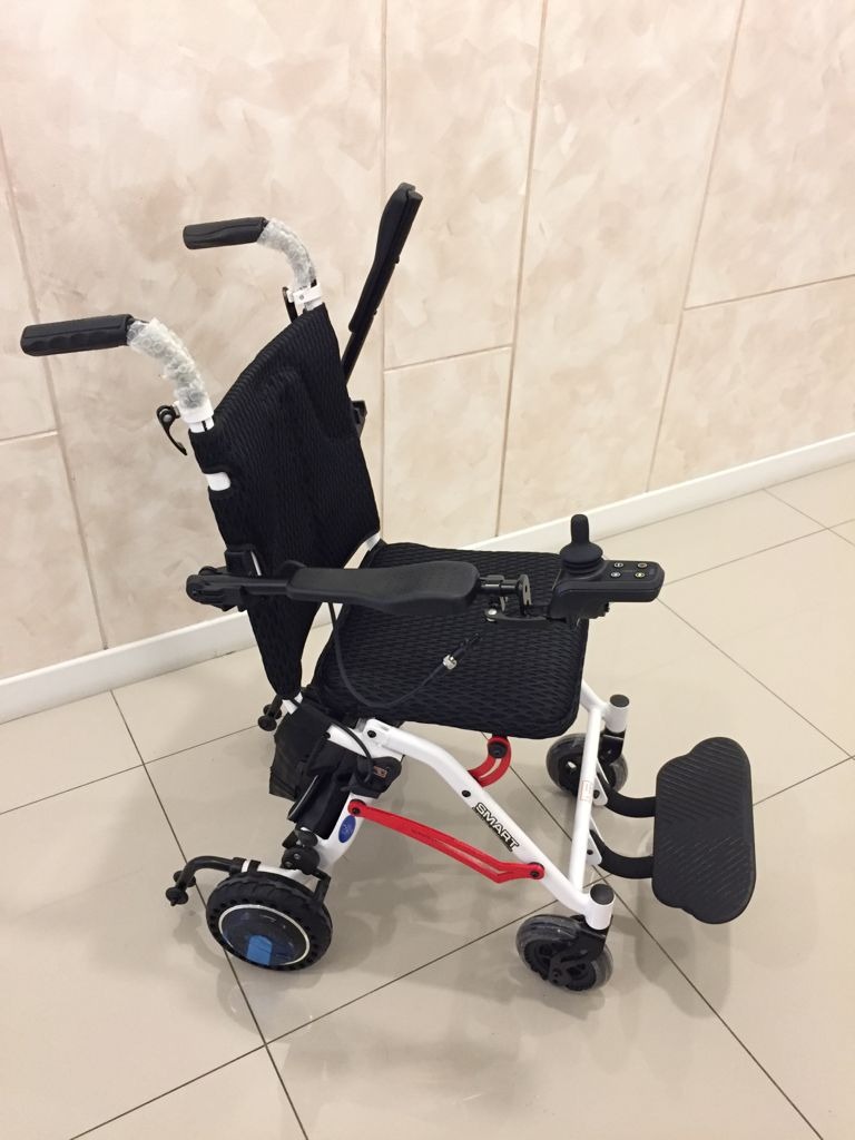 Felco DX-2 FMEW002 Smart brushless electric wheelchair with black mesh seat and joystick controller on the armrest